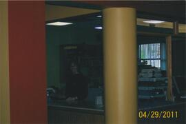 Kim Perry at the circulation desk - 100 Holland Court