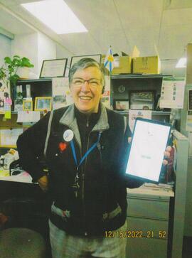 Heidi Northover with a tablet - 35 years of service