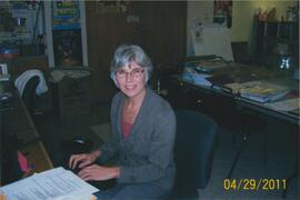 Debbie Scott at their desk - 100 Holland Court