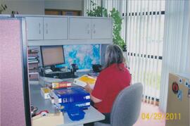 Anita Donald at their desk at 100 Holland Court