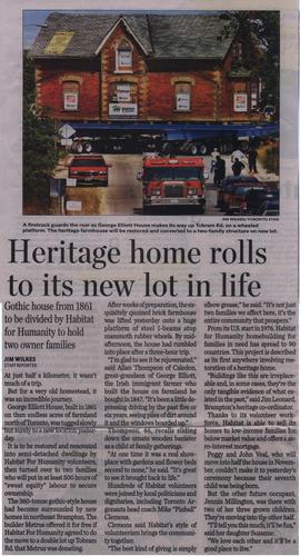 Heritage home rolls to its new lot in life