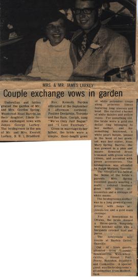 Couple exchange vows in garden